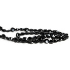 6 - 7mm Black Spinel Faceted Coins 12 inch 55 beads - The Bead Traders
