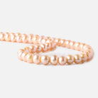 6 - 7mm Creamsicle Orange Large Hole Off Round Pearls 15 inch 75 beads - The Bead Traders
