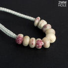 6 - 7mm Thulite 2mm Large Hole Rondelles 10 Beads - The Bead Traders