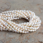 6.5x5mm Cream Petite Baroque Pearls 15 inch 56 beads - The Bead Traders