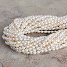 6.5x5mm Cream Petite Ringed Baroque Pearls 15 inch 58 beads - The Bead Traders