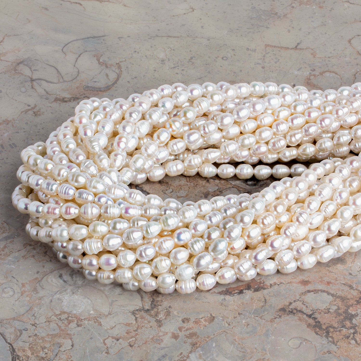 6.5x5mm Cream Petite Ringed Baroque Pearls 15 inch 58 beads - The Bead Traders