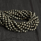 6mm Pyrite Faceted Rounds 12 inch 56 beads - The Bead Traders