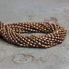 6x4mm Brassy Oval Freshwater Pearls 15 inch 70 pieces - The Bead Traders