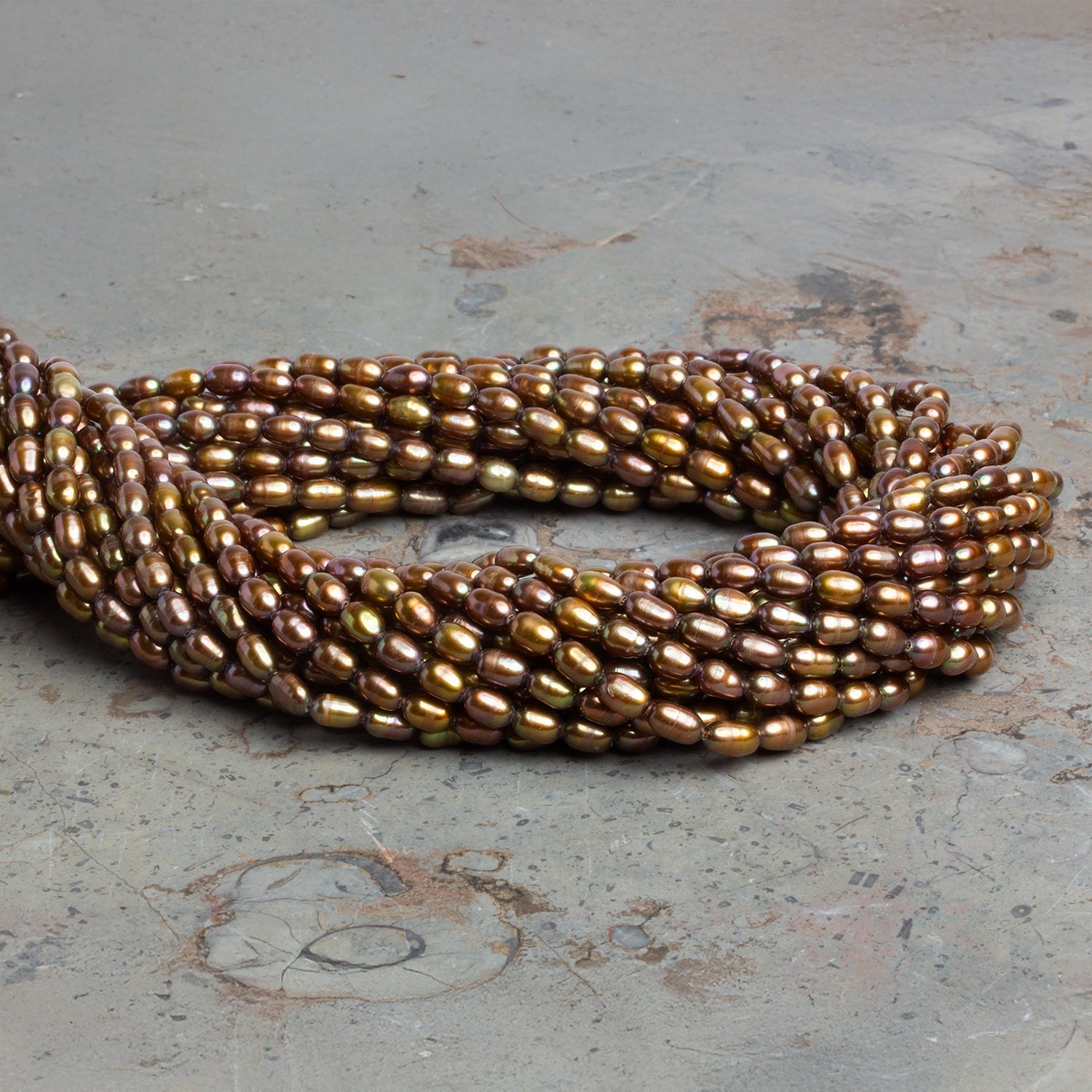 6x4mm Brassy Oval Freshwater Pearls 15 inch 70 pieces - The Bead Traders