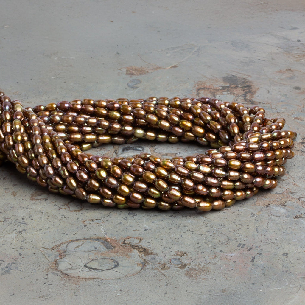 6x4mm Brassy Oval Freshwater Pearls 15 inch 70 pieces - The Bead Traders