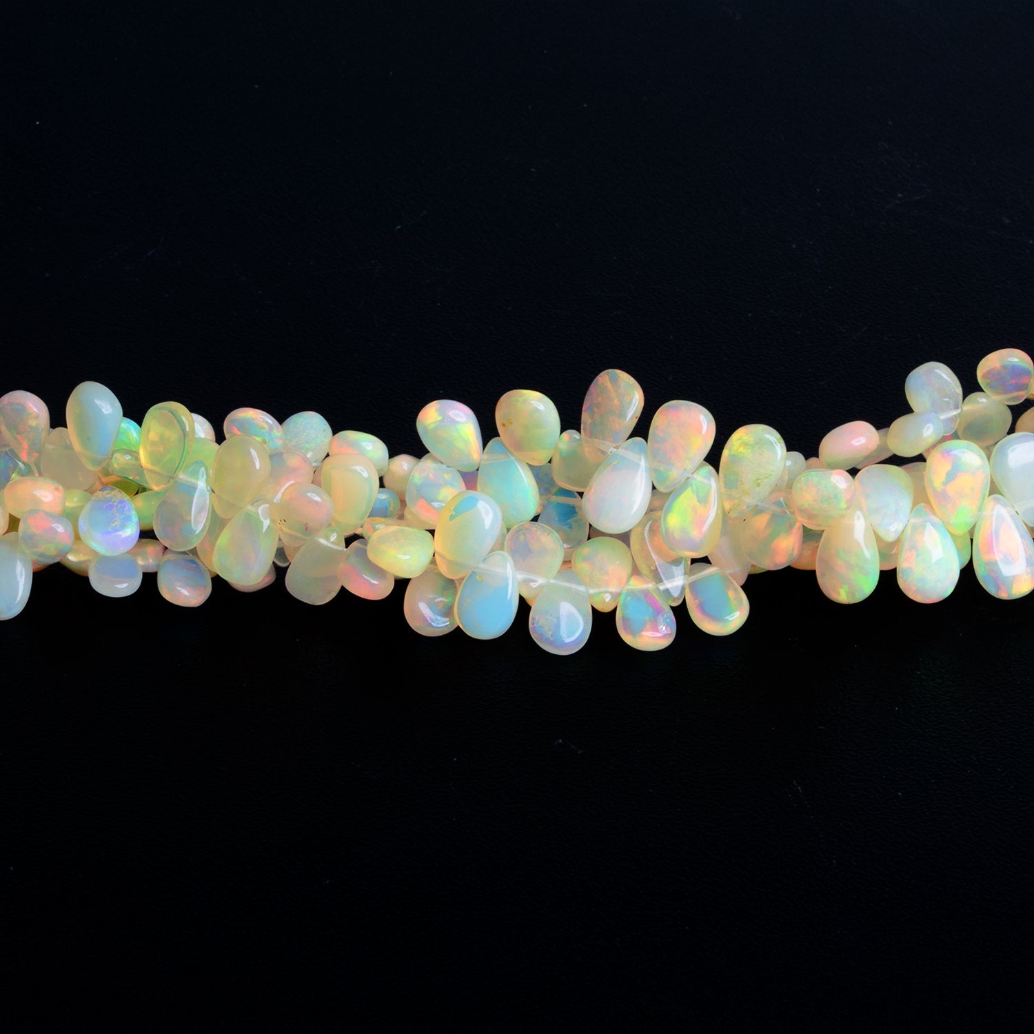 6x4mm Ethiopian Opal Plain Pears 9 inch 75 beads - The Bead Traders