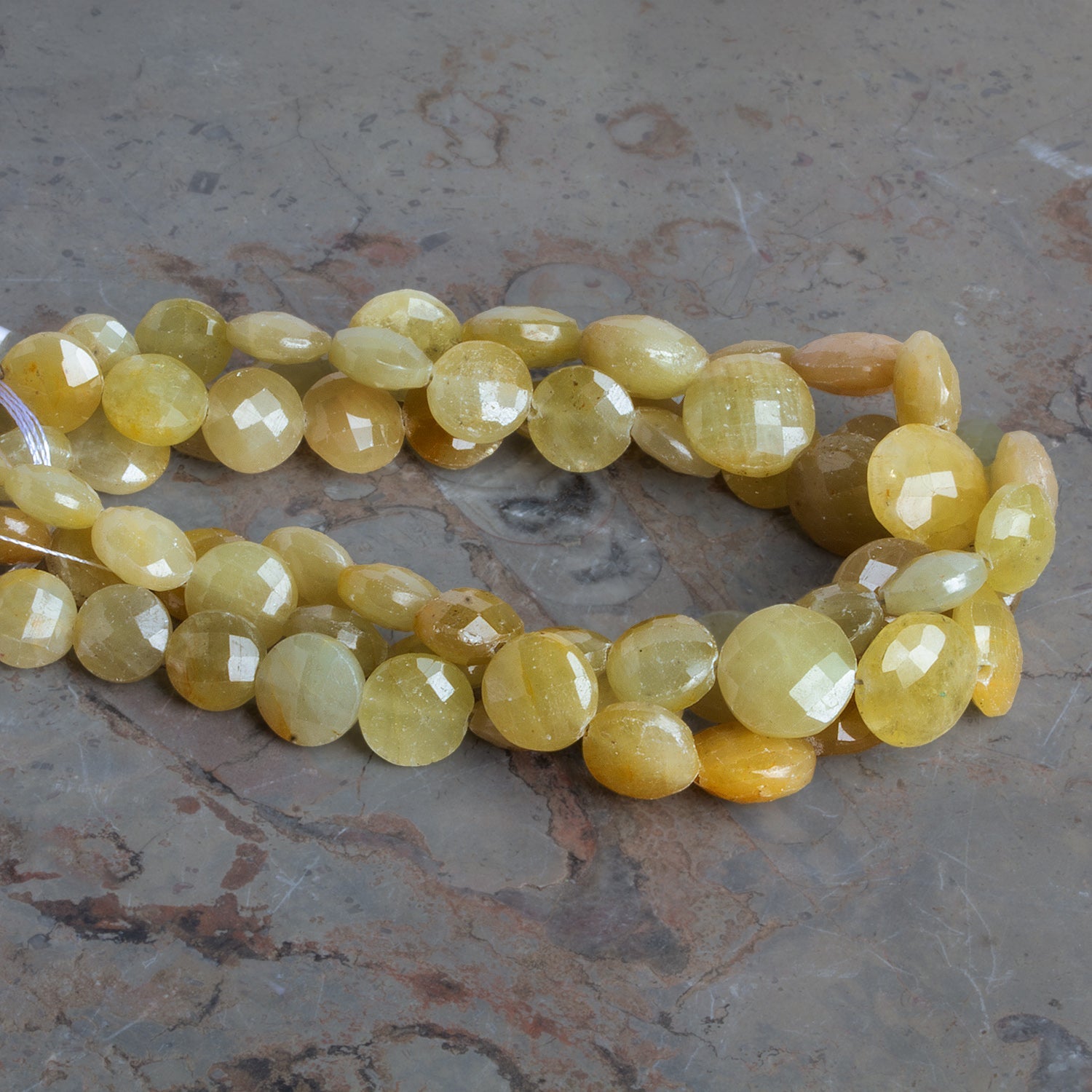 7 - 11mm Yellow Sapphire Faceted Coins 8 inch 21 beads - The Bead Traders