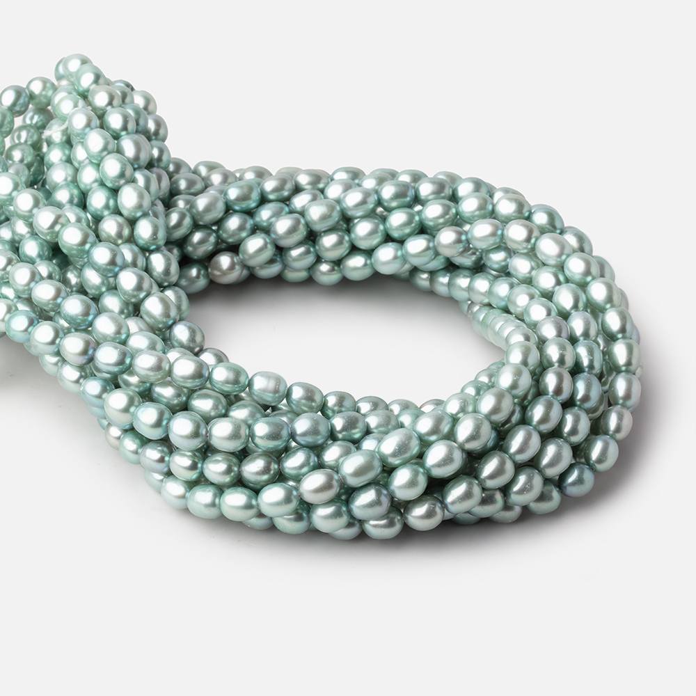 7 - 8mm Mint Green Oval Pearls 16 inch 55 beads - The Bead Traders