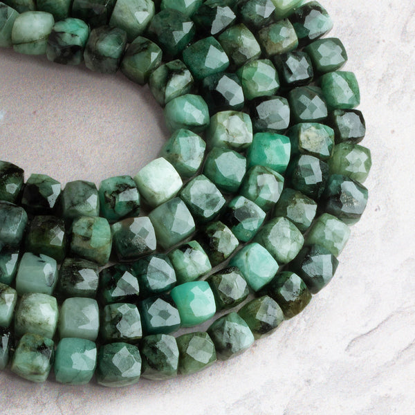 7mm Emerald Faceted Cubes 7.5 inch 25 beads