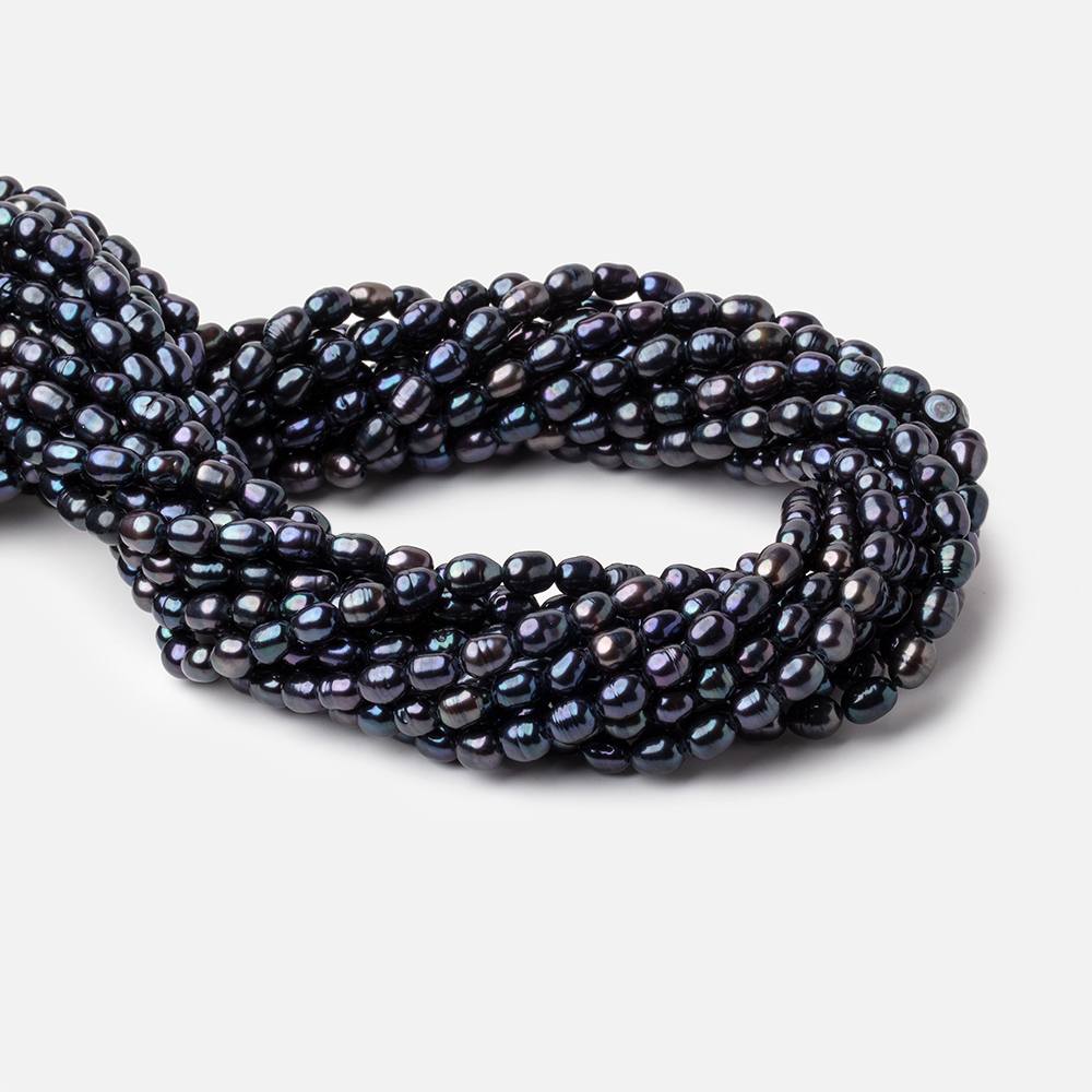 8x5mm Dark Navy Peacock Oval Pearls 15 inch 60 beads - The Bead Traders