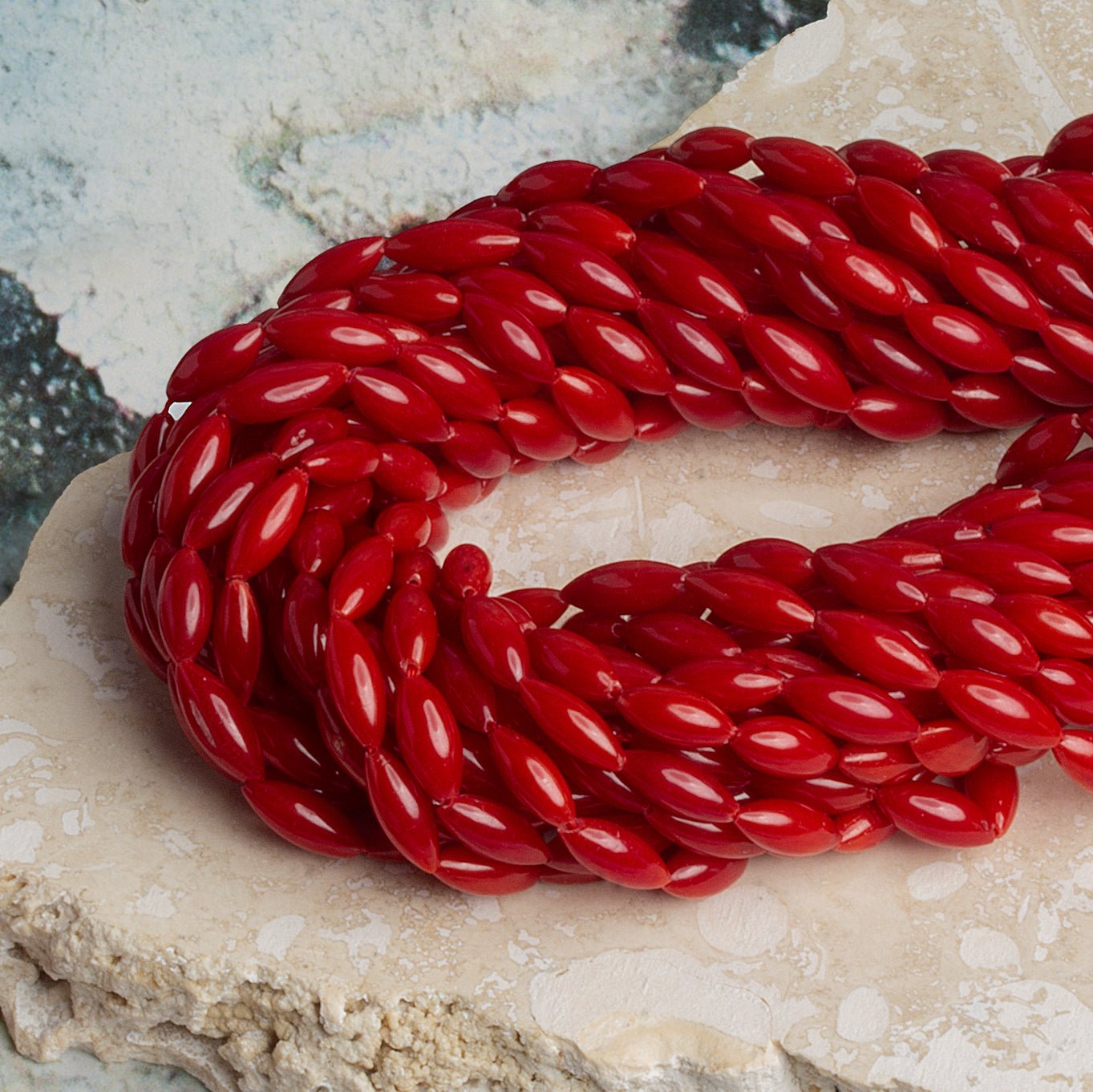 9x3mm Red Coral Rice 16 inch 50 beads - The Bead Traders