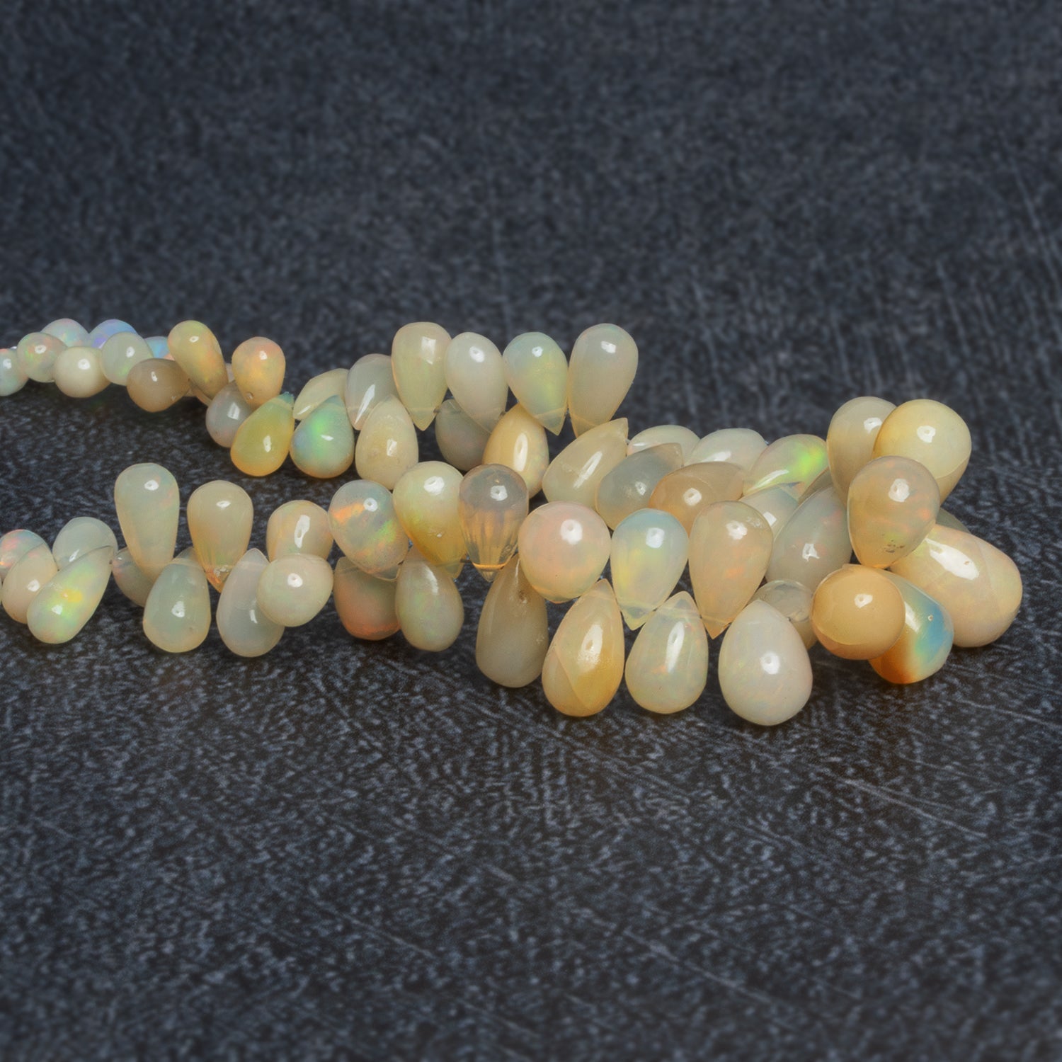 9x6mm Ethiopian Opal Plain Teardrops 8 inch 70 beads - The Bead Traders