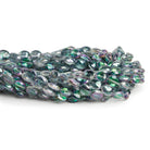 9x7mm Mystic White Topaz Faceted Ovals 9 inch 25 beads - The Bead Traders
