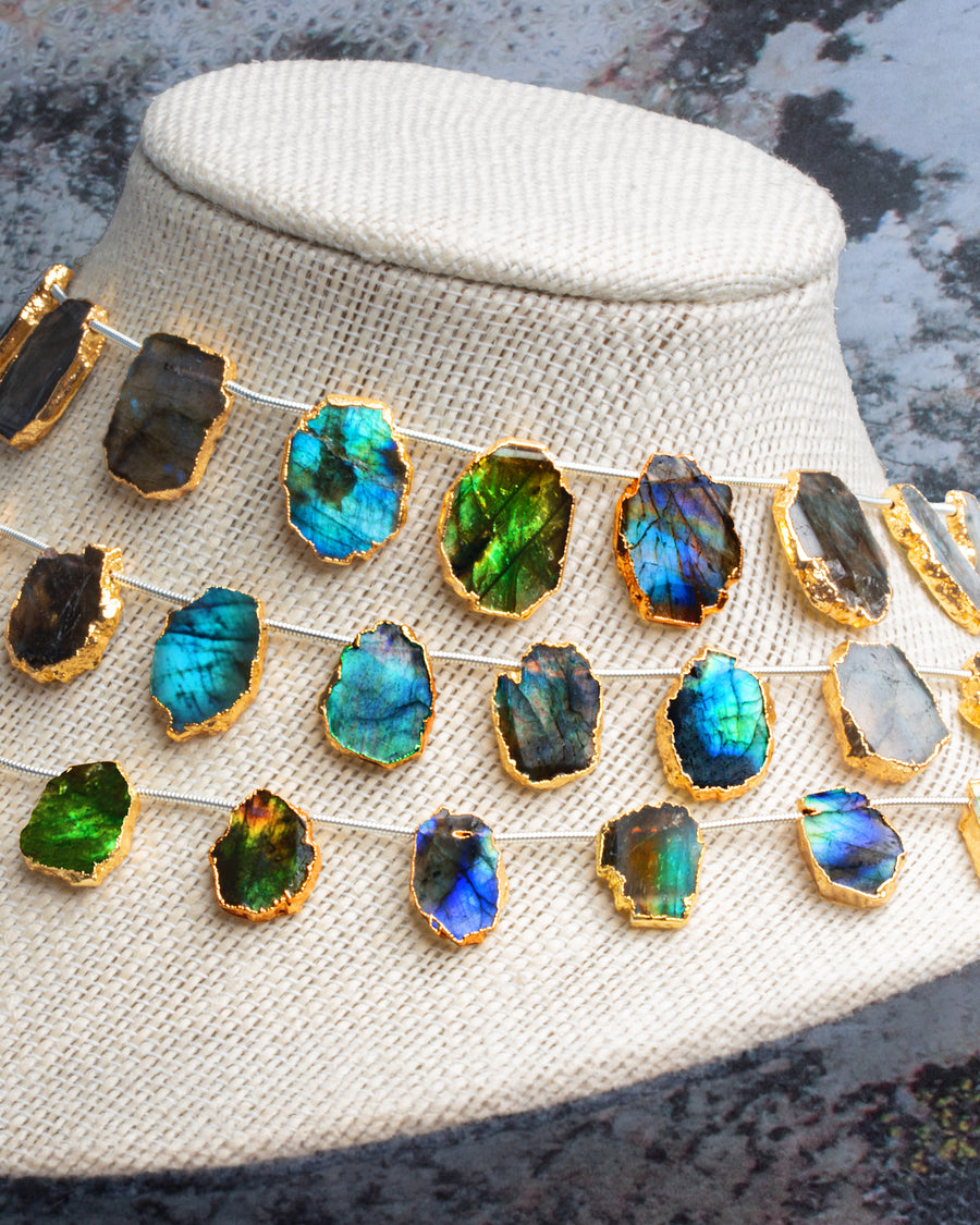 Gold leafed labradorite strands on a bust