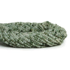 2-2.5mm Green Tourmalinated Quartz Microfaceted Rounds 12 inch 140 beads - The Bead Traders