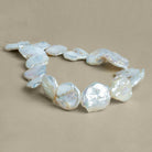 21-23mm White Coin Freshwater Pearls 15 inch 17 pieces - The Bead Traders