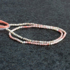 2.5mm Thulite Microfaceted Rounds 12 inch 130 beads - The Bead Traders