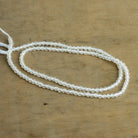 2.5mm White Topaz Microfaceted Rounds 12 inch 130 beads - The Bead Traders