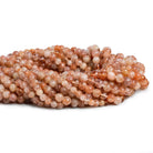 3.5-5mm Sunstone Handcut Rounds 12 inch 70 pieces - The Bead Traders