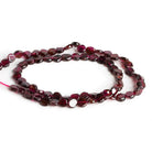 4-6mm Garnet Plain Coins 14 inch 61 beads - The Bead Traders