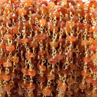 4.5-5mm Shaded Carnelian plain rondelle Gold Chain by the foot 33 pcs - The Bead Traders