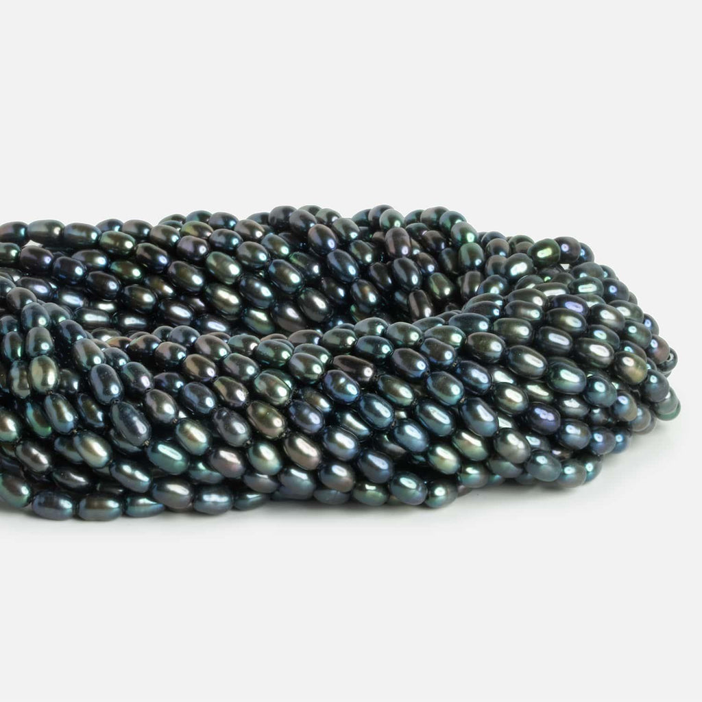 4x5mm Peacock Green Oval Pearls 15 inch 57 beads - The Bead Traders
