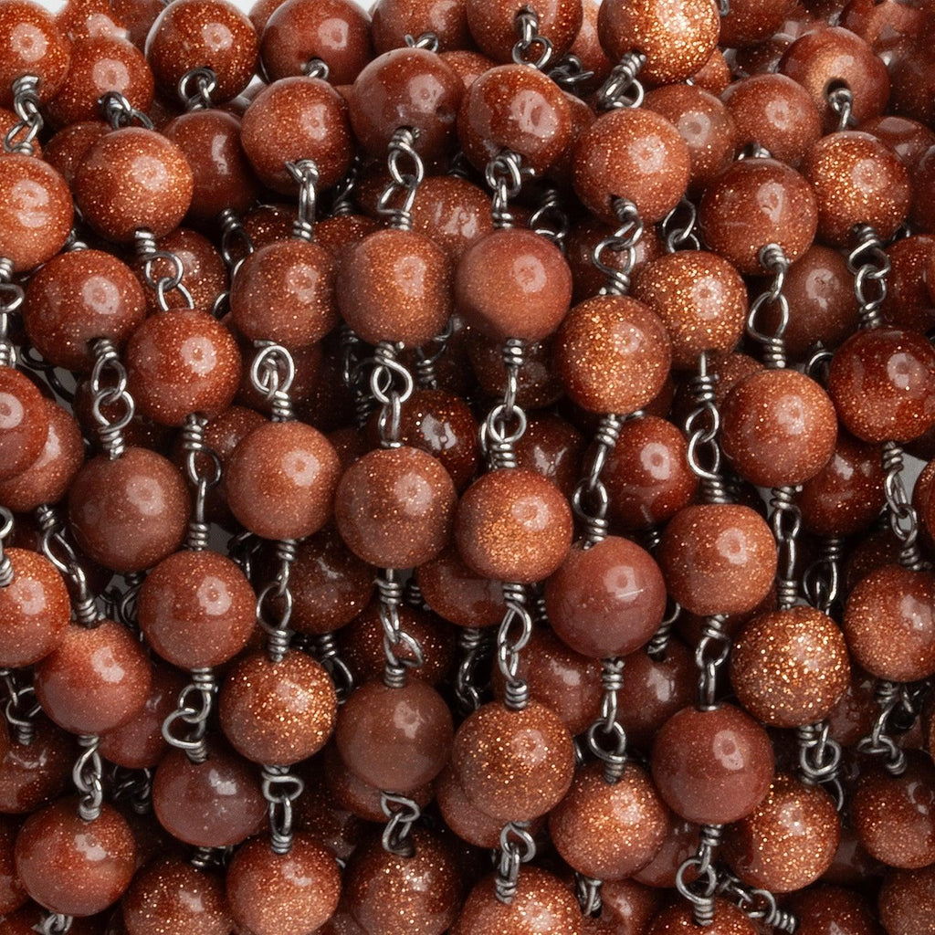 5-5.5mm Goldstone plain round Black Gold Chain sold by the foot - The Bead Traders