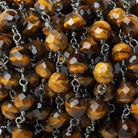 5.5-6mm Tiger's Eye Faceted Round Black Gold plated Chain by the foot - The Bead Traders