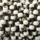 6mm White Ox Bone rounds Black Gold plated Cap and Chain by the foot 21 pcs - The Bead Traders