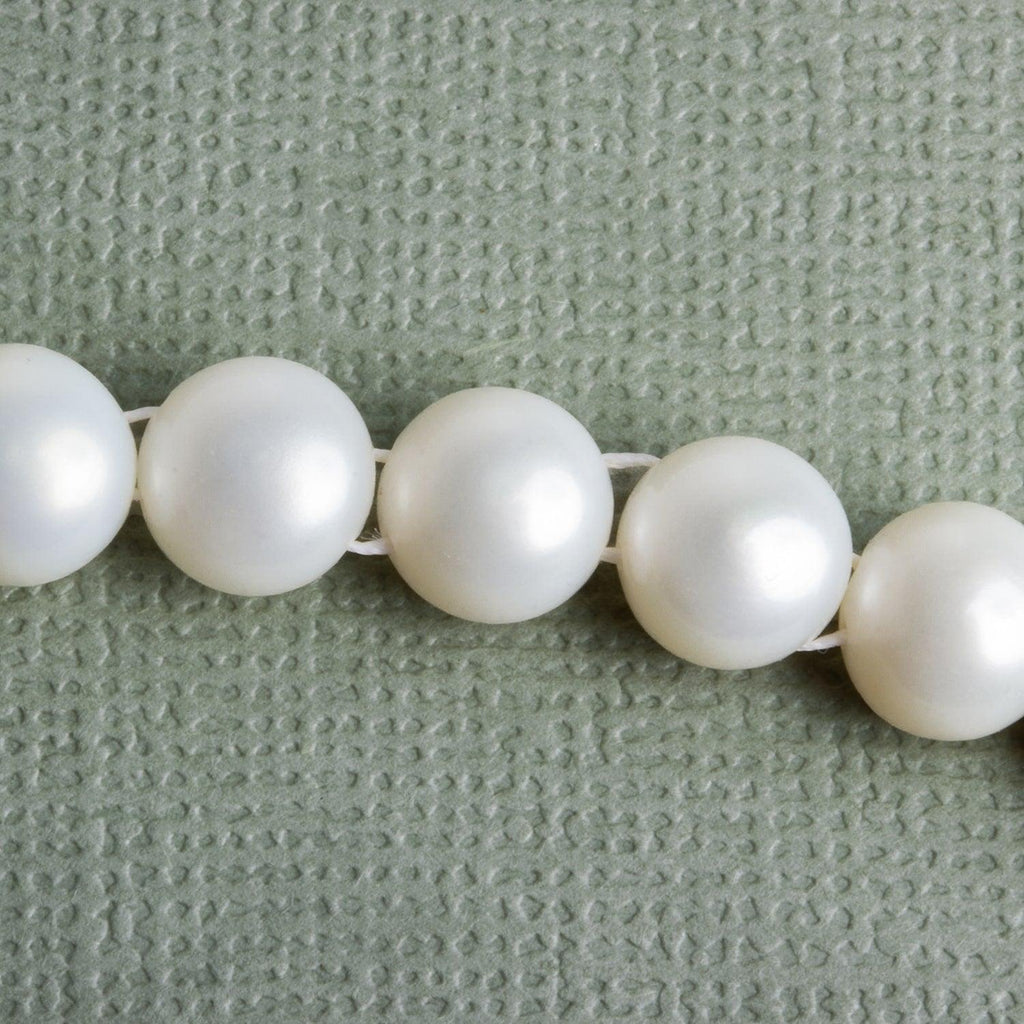 7mm White Double-Drilled Button Pearls 15 inch 50 pieces - The Bead Traders