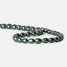 7x5mm Green Peacock Large Hole Oval Pearls 15 inch 48 pieces - The Bead Traders