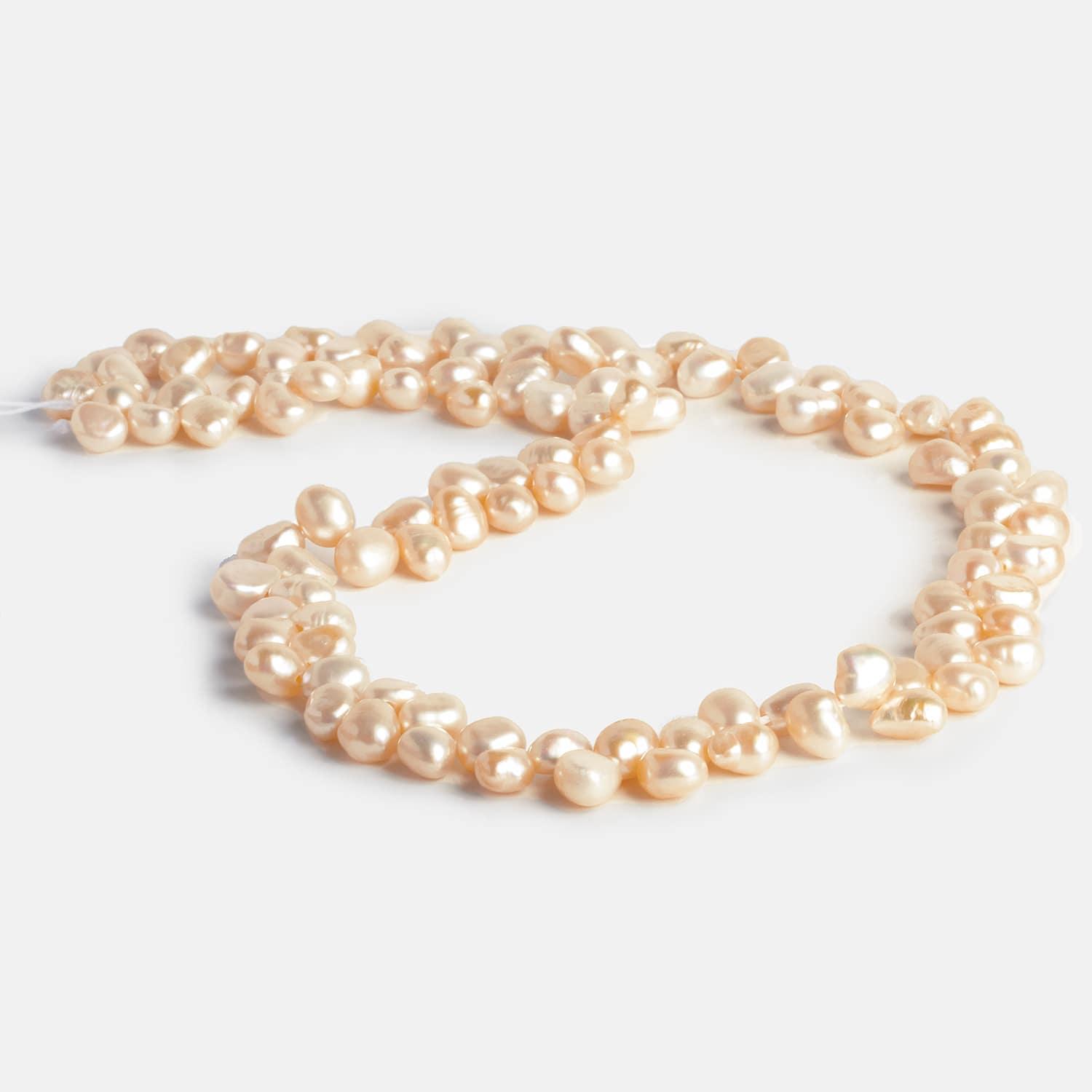 7x5mm Peach Baroque Pearls 15 inch 100 pieces - The Bead Traders