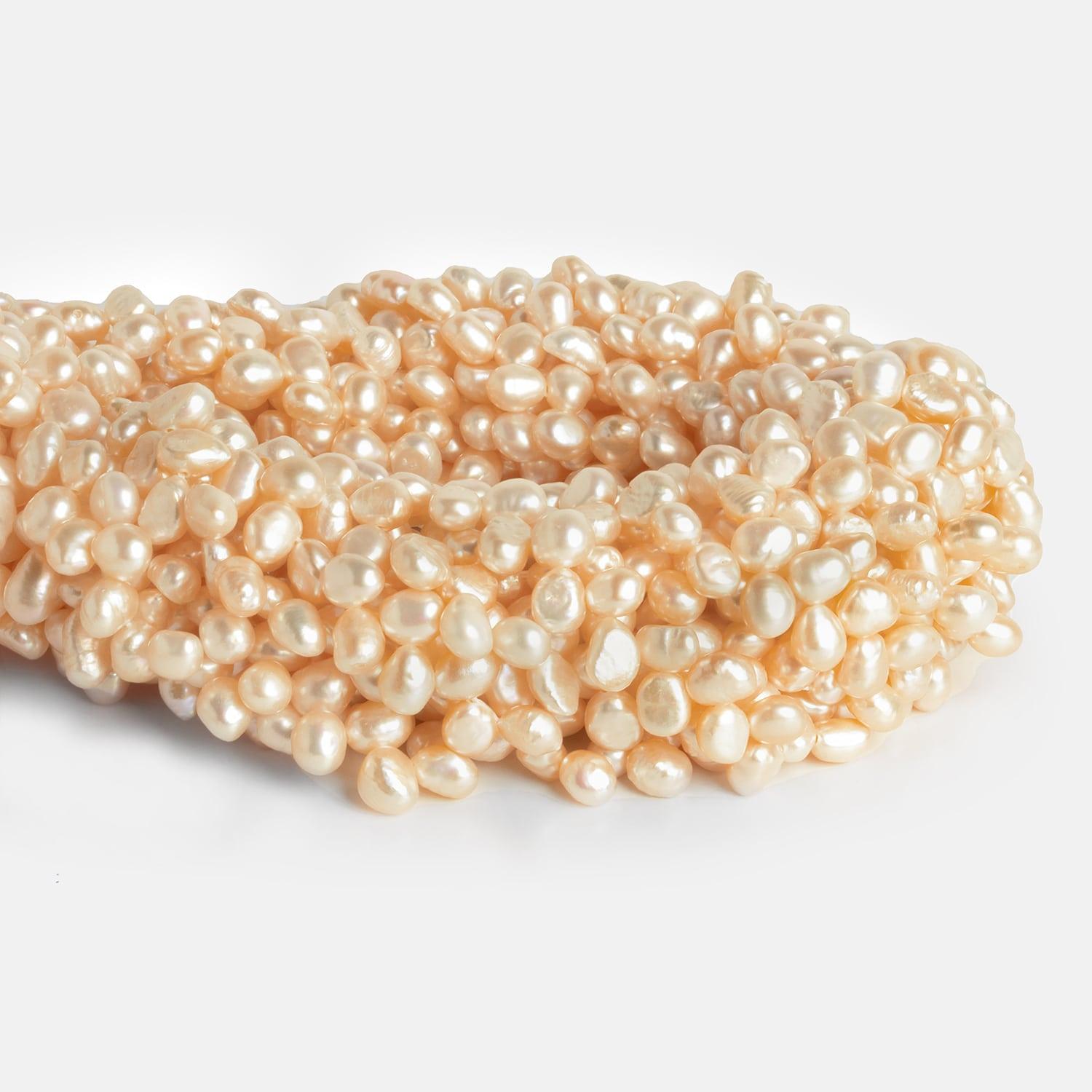 7x5mm Peach Baroque Pearls 15 inch 100 pieces - The Bead Traders