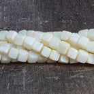 7x7-9x9mm White & Yellow Opal plain cubes 6.5 inch 46 Beads - The Bead Traders
