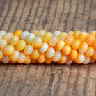 8-9mm Orange Opal Plain Rondelles 16 inch 70 beads - The Bead Traders