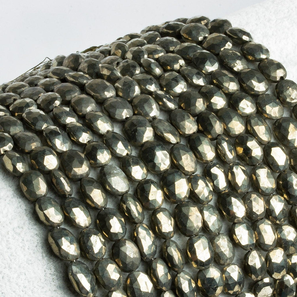 8x6-9.5x7mm Golden Pyrite faceted ovals 8 inch 22 beads - The Bead Traders