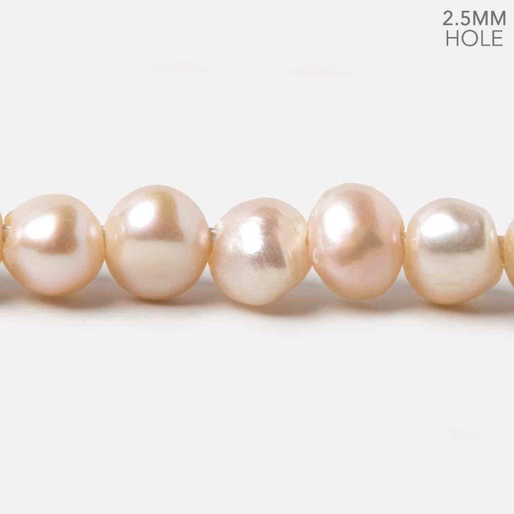 9.5-11mm Peach Baroque 2.5mm Large Hole Pearls 15 inch 49 pieces - The Bead Traders