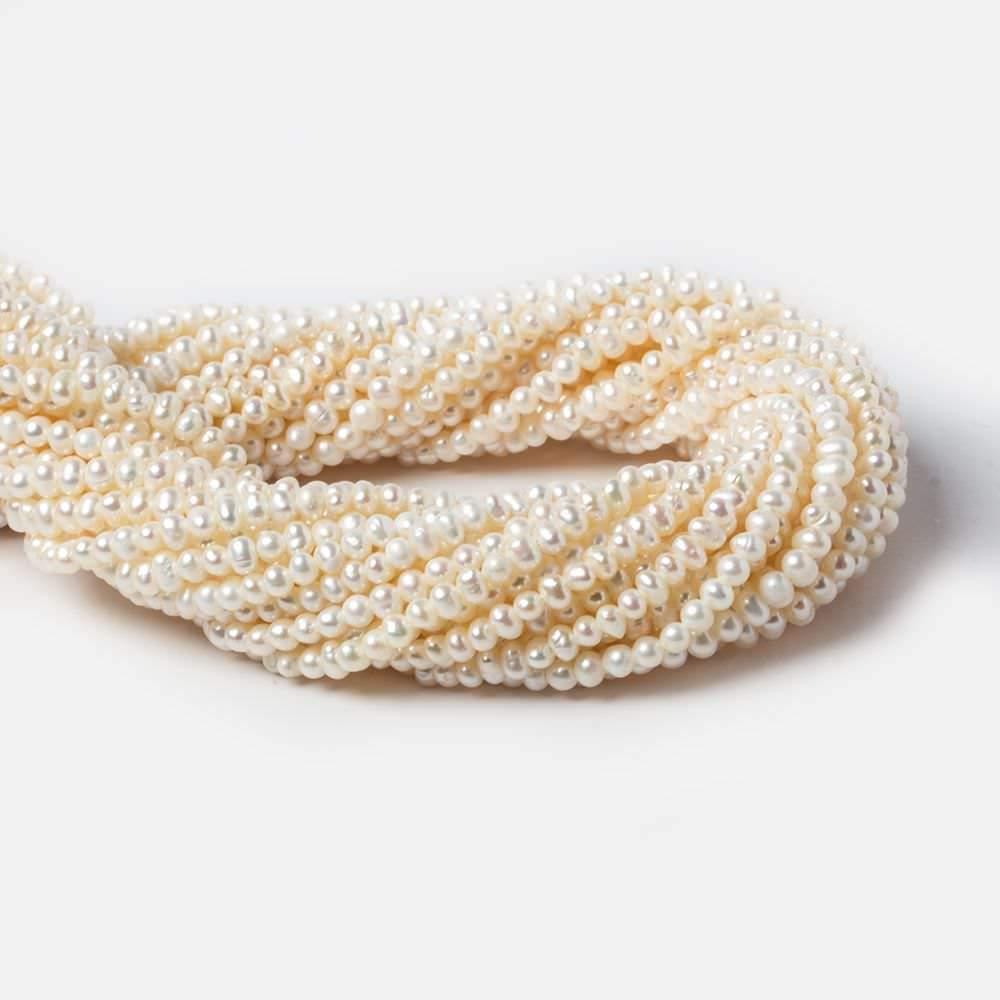 Cream Side Drilled Baroque Freshwater Pearls 16 inch 144 pieces - The Bead Traders