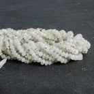 Dalmatian Rainbow Moonstone Rondelles 12 inch 74 beads - The Bead Traders