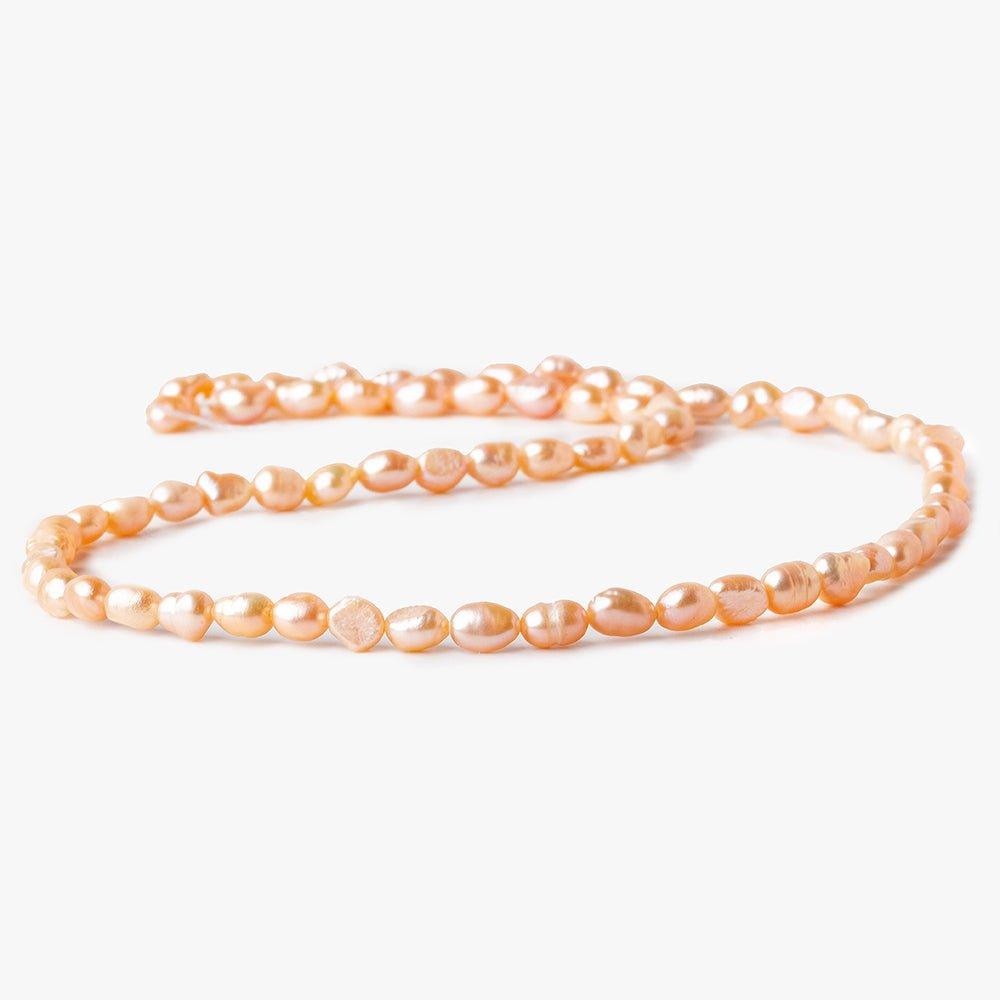 Peach Petite Baroque Freshwater Pearl 16 inch 50 pieces 5x4mm - 7x4mm - The Bead Traders